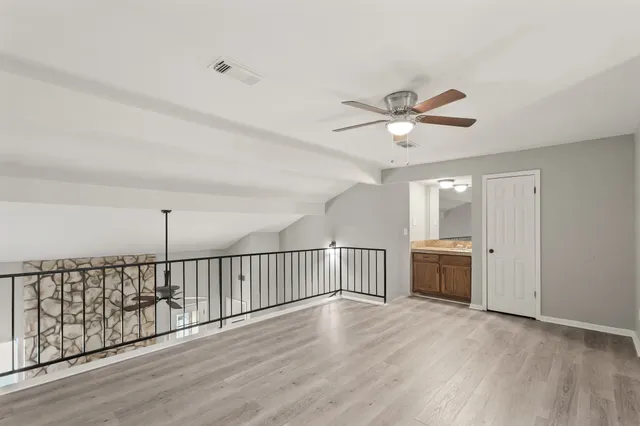 a view of a livingroom with a hardwood floor
