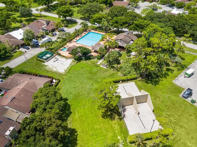 an aerial view of residential house with outdoor space and swimming pool