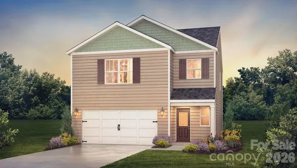 a view of a house with a yard and plants