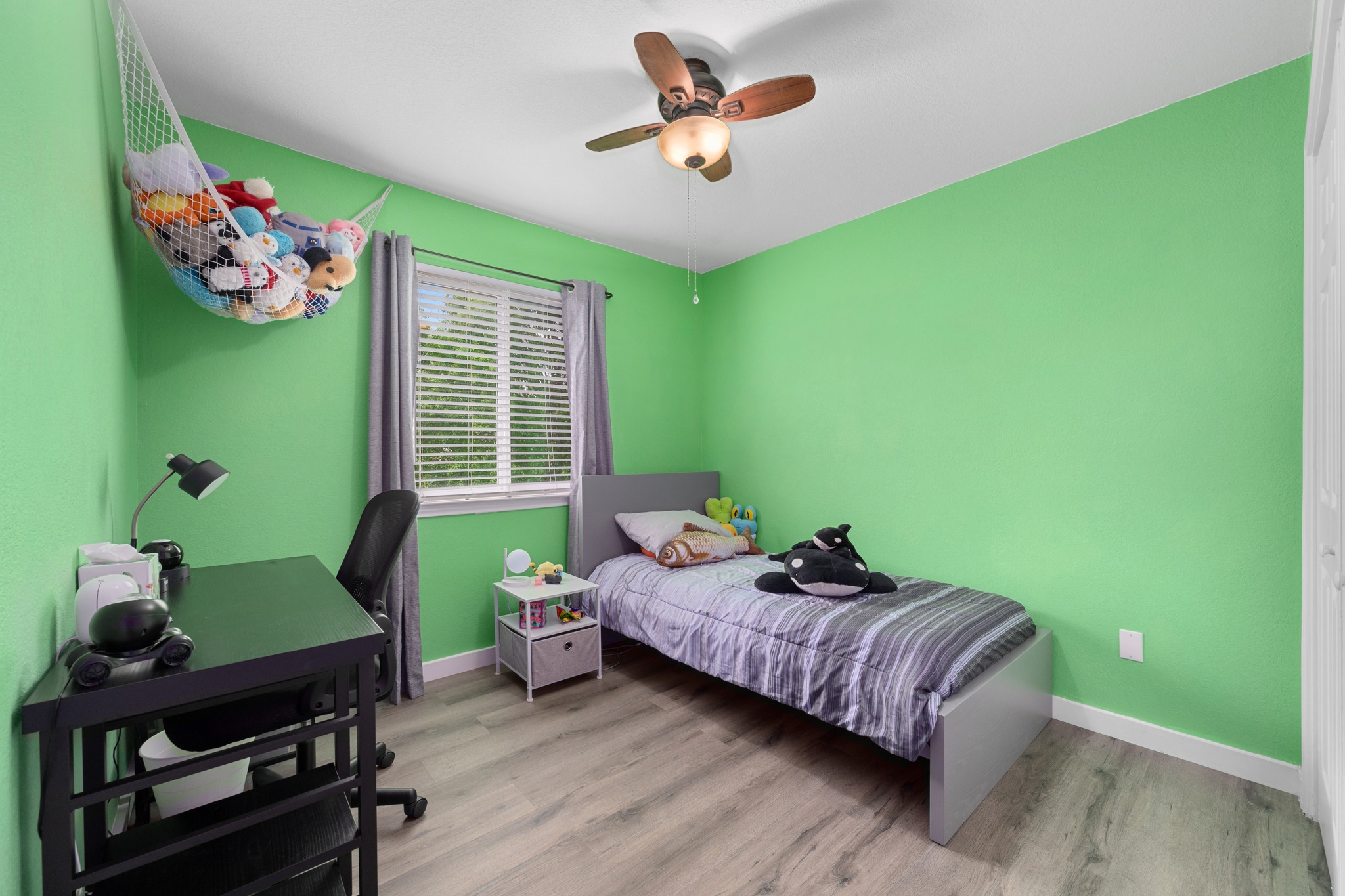 3408 Ruby Red Drive Austin, TX 78728 - Photo 19 of 26 a bedroom with a bed table and a window