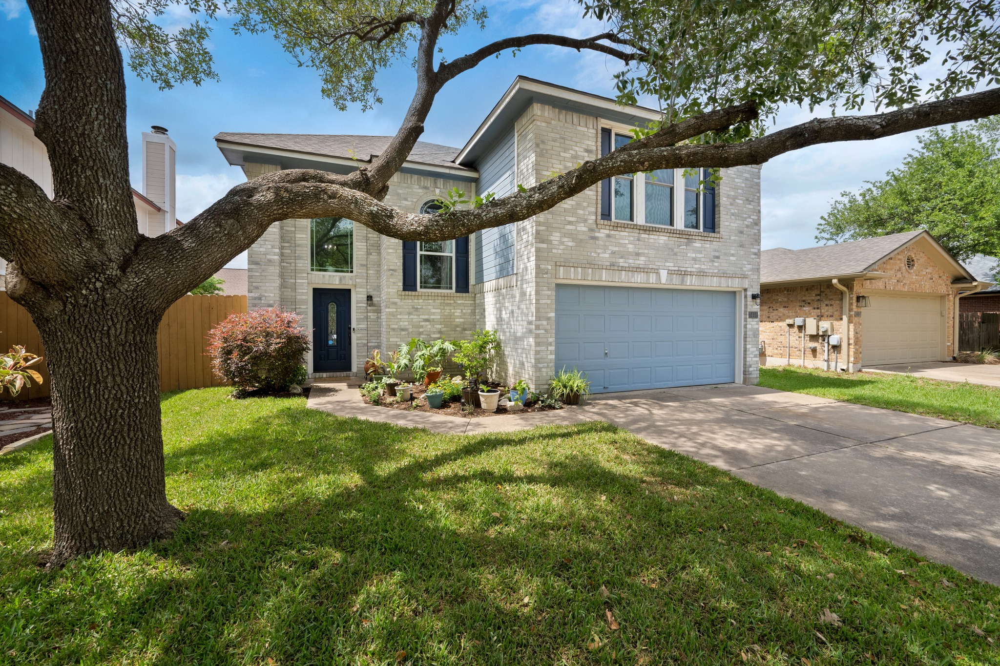 3408 Ruby Red Drive Austin, TX 78728 - Photo 2 of 26 a front view of a house with a yard and garage