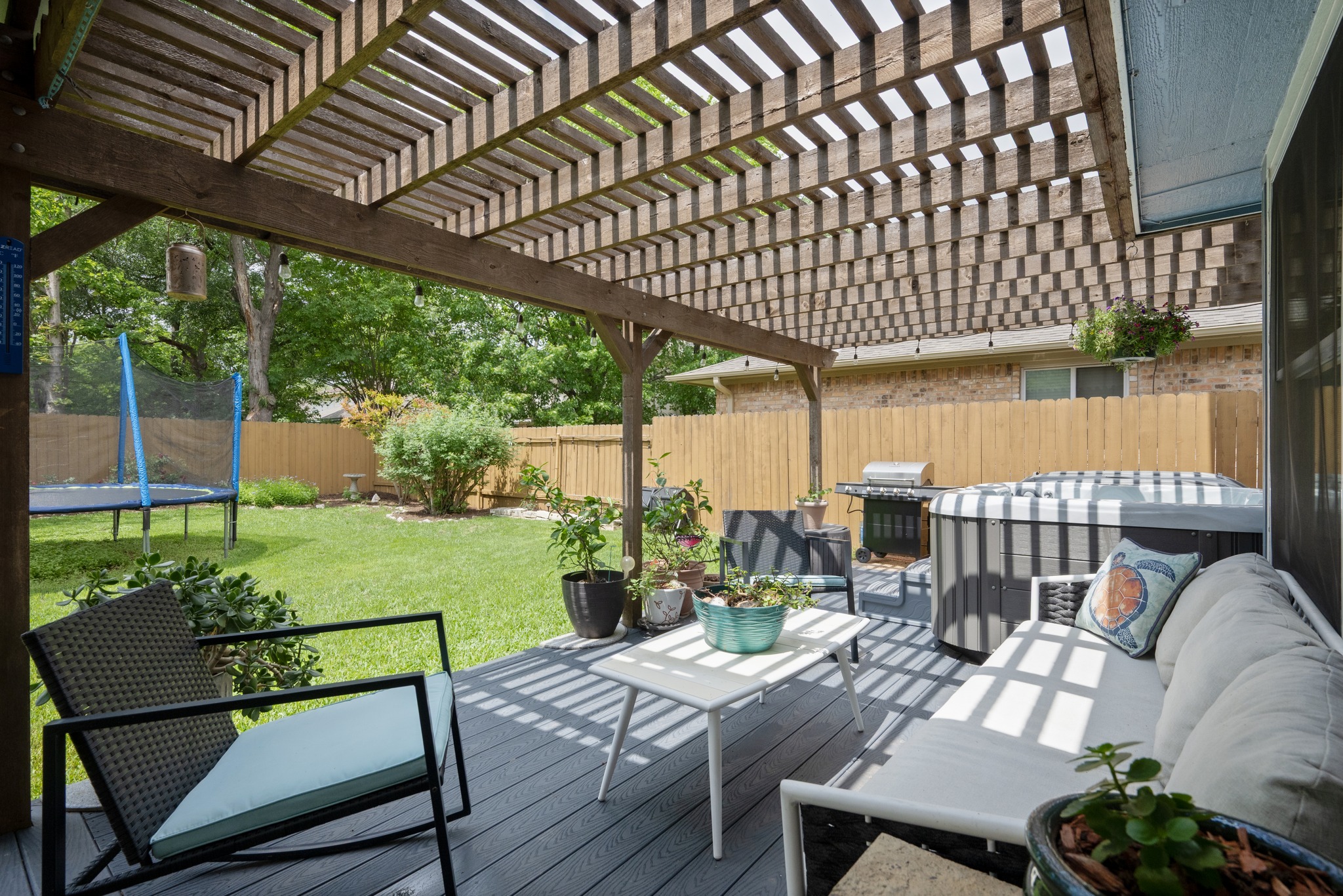 3408 Ruby Red Drive Austin, TX 78728 - Photo 21 of 26 a view of a patio with table and chairs potted plants with wooden floor and fence