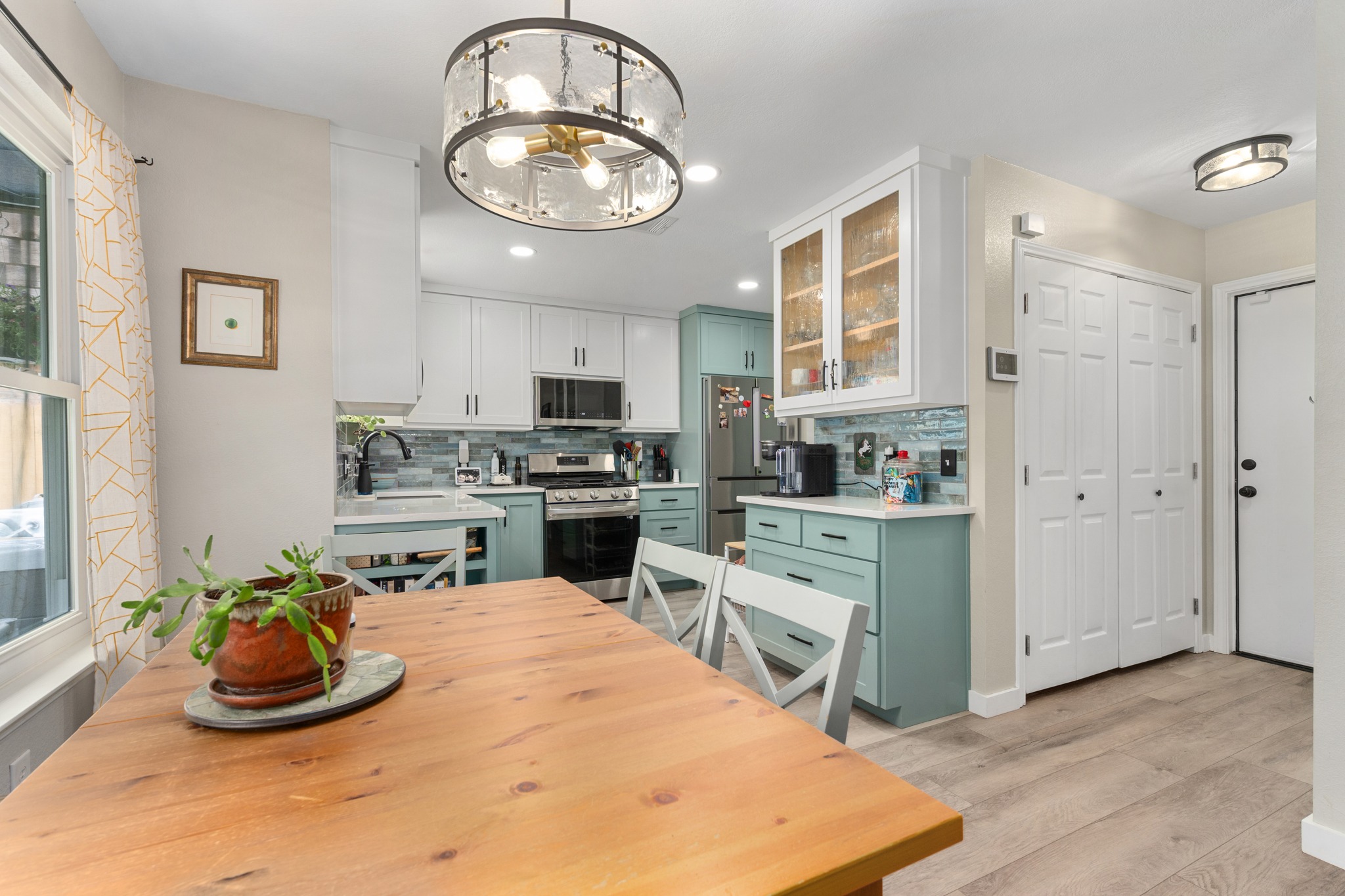 3408 Ruby Red Drive Austin, TX 78728 - Photo 9 of 26 a kitchen with a refrigerator and white cabinets