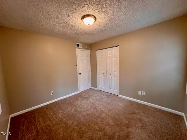 a bathroom with a toilet and a bath tub