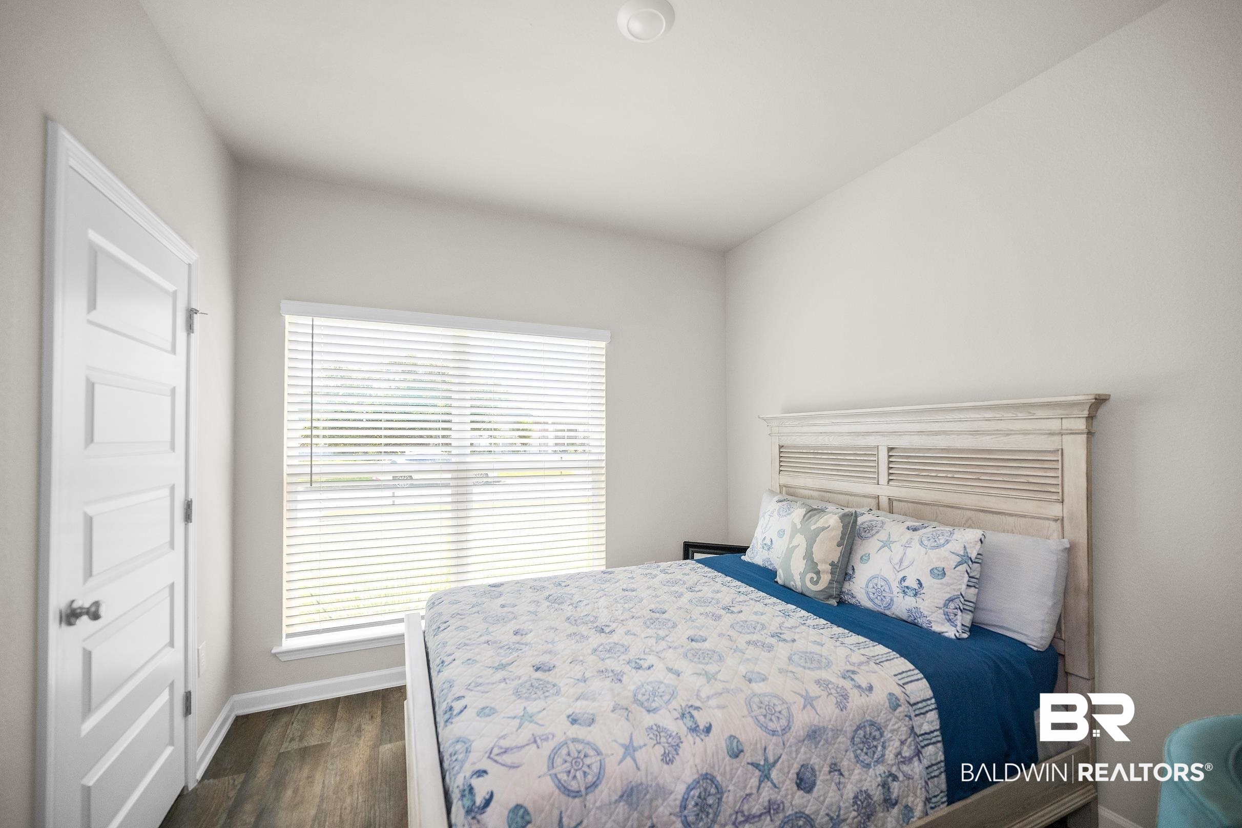 23997 Veranda Circle Elberta, AL 36530 - Photo 9 of 28 Neutral wall paint with wood-finish flooring