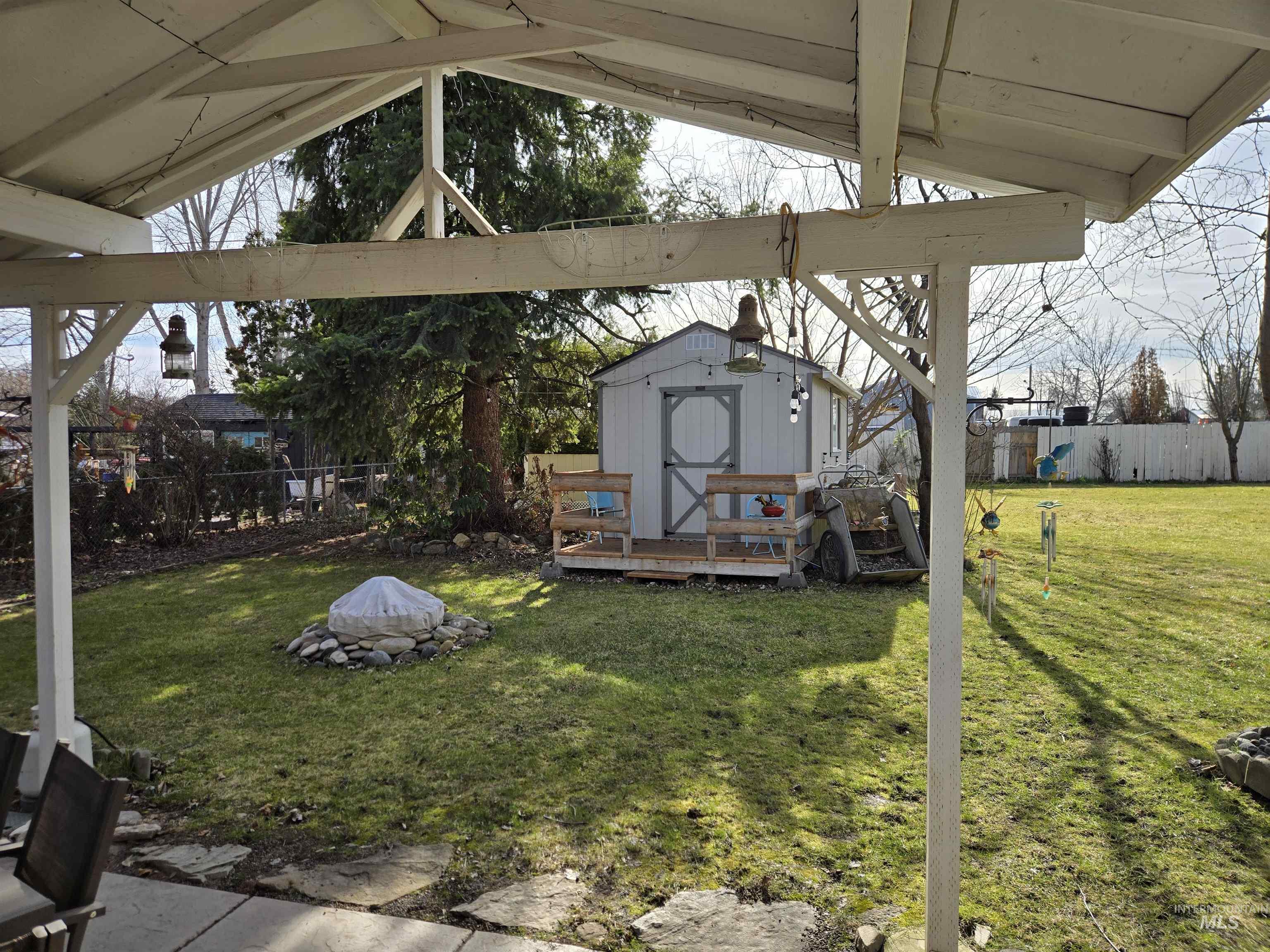 1322 Grelle Avenue Lewiston, ID 83501 - Photo 11 of 22 Fenced backyard with a storage unit