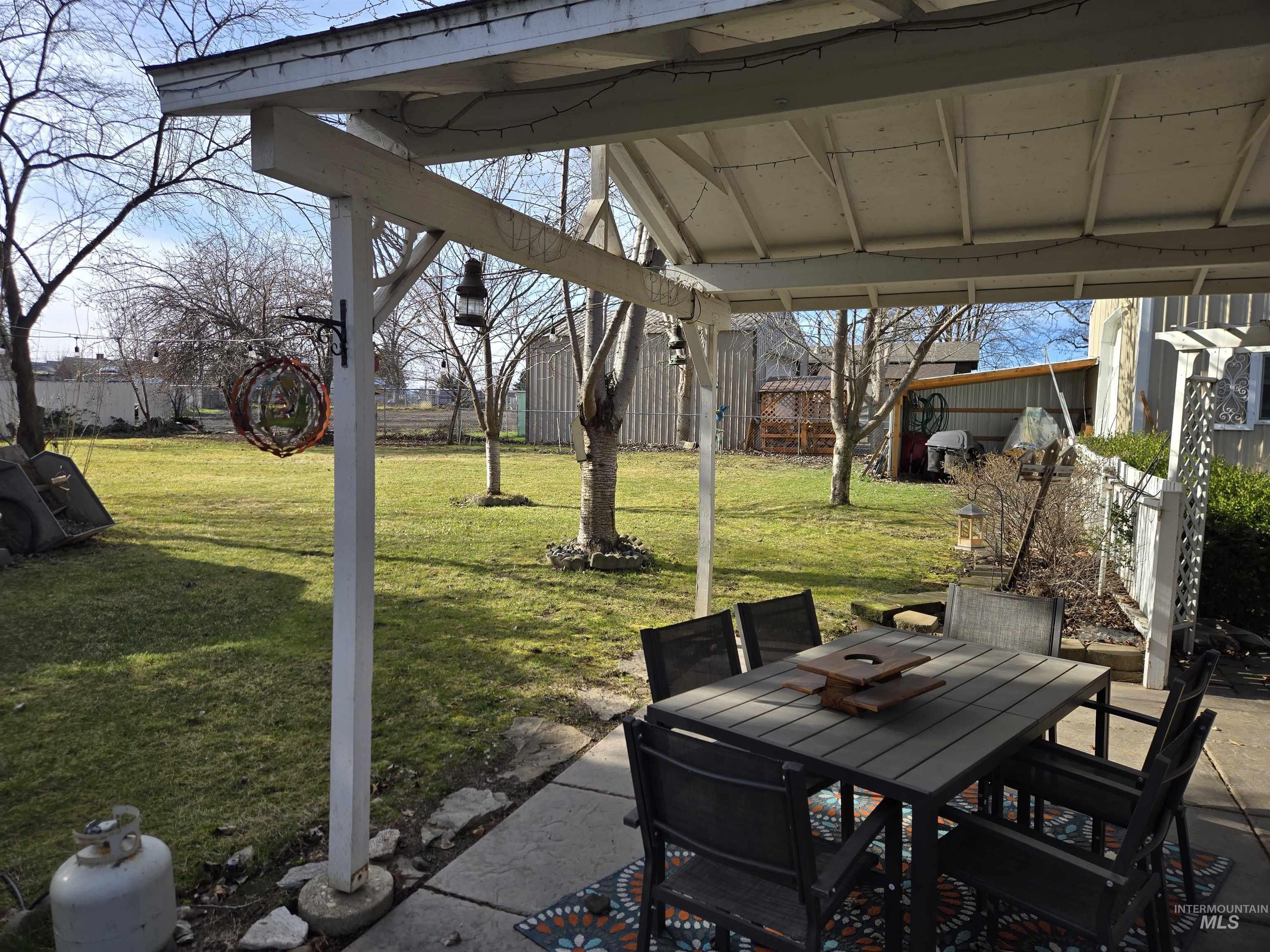 1322 Grelle Avenue Lewiston, ID 83501 - Photo 12 of 22 Fenced backyard featuring outdoor dining area and a patio area