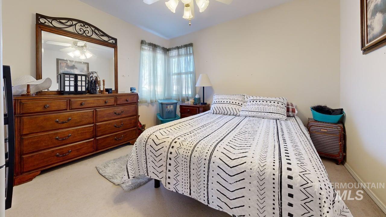 1322 Grelle Avenue Lewiston, ID 83501 - Photo 15 of 22 Bedroom with light colored carpet and a ceiling fan