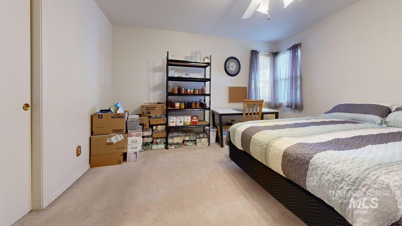 1322 Grelle Avenue Lewiston, ID 83501 - Photo 16 of 22 Bedroom featuring light colored carpet and ceiling fan