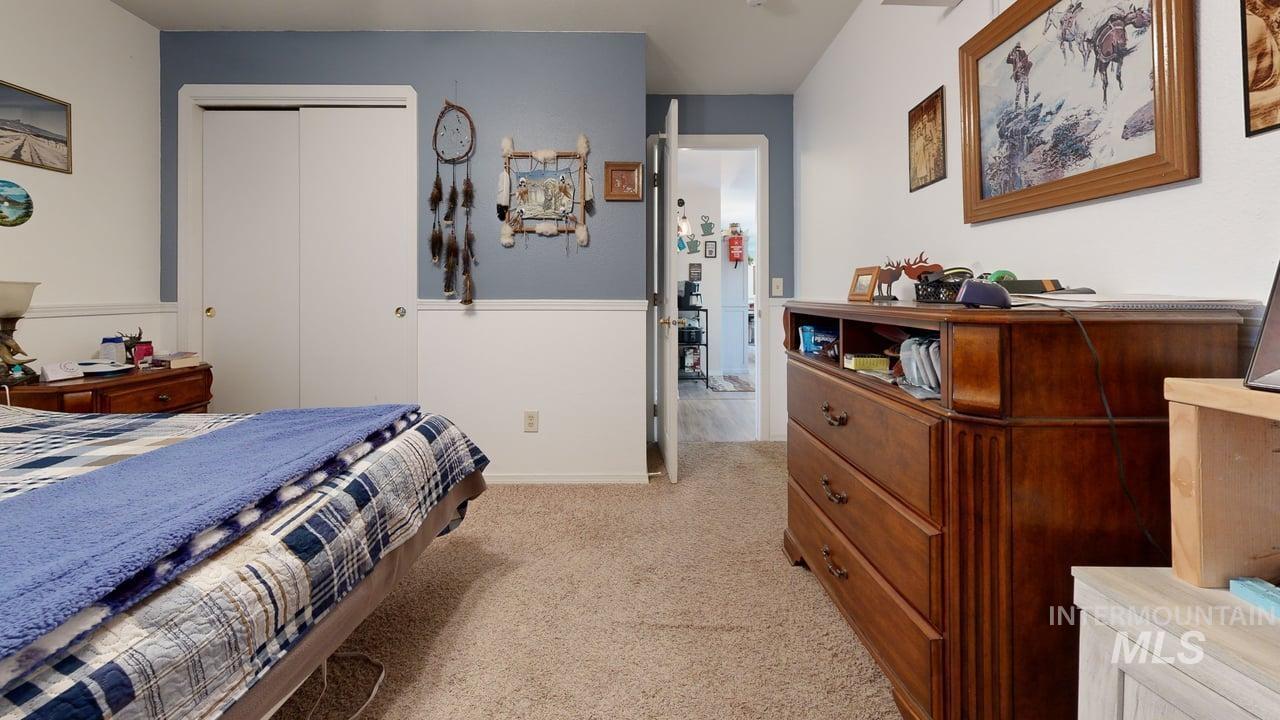 1322 Grelle Avenue Lewiston, ID 83501 - Photo 18 of 22 Bedroom with light carpet and a closet