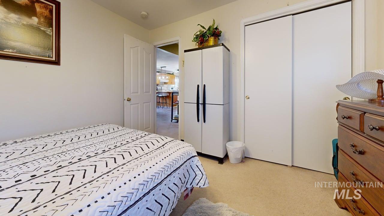 1322 Grelle Avenue Lewiston, ID 83501 - Photo 20 of 22 Bedroom featuring light colored carpet and a closet
