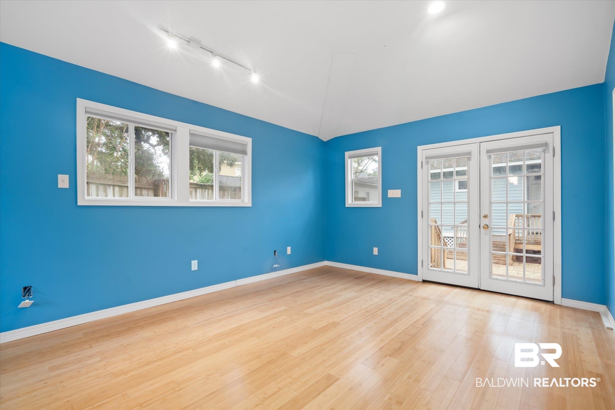 14 South Monterey Street Mobile, AL 36604 - Photo 23 of 41 Unfurnished room featuring plenty of natural light, light hardwood / wood-style flooring, and french doors