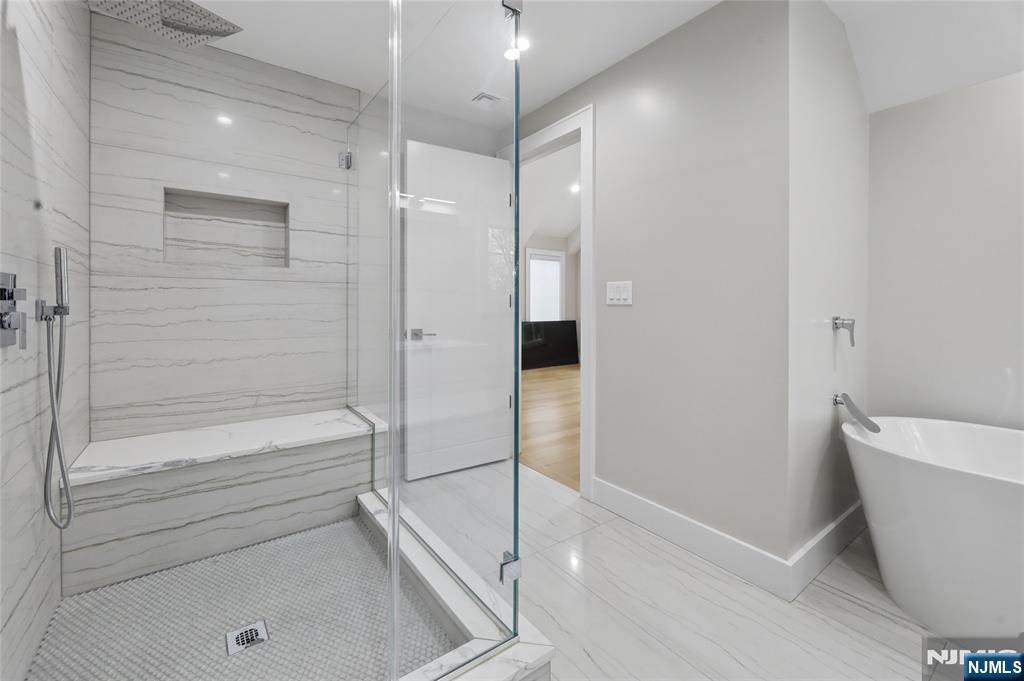 31 Engleside Street Cresskill, NJ 07626 - Photo 31 of 49 a bathroom with a bathtub and a shower