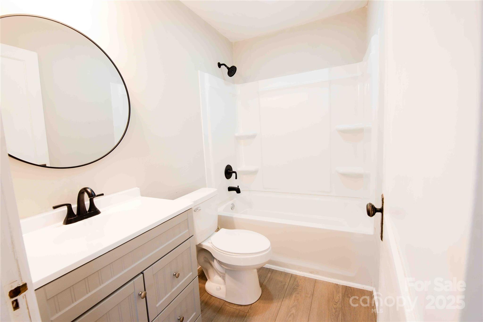 207 North Love Chapel Road Stanfield, NC 28163 - Photo 16 of 21 a bathroom with a sink a toilet and a mirror