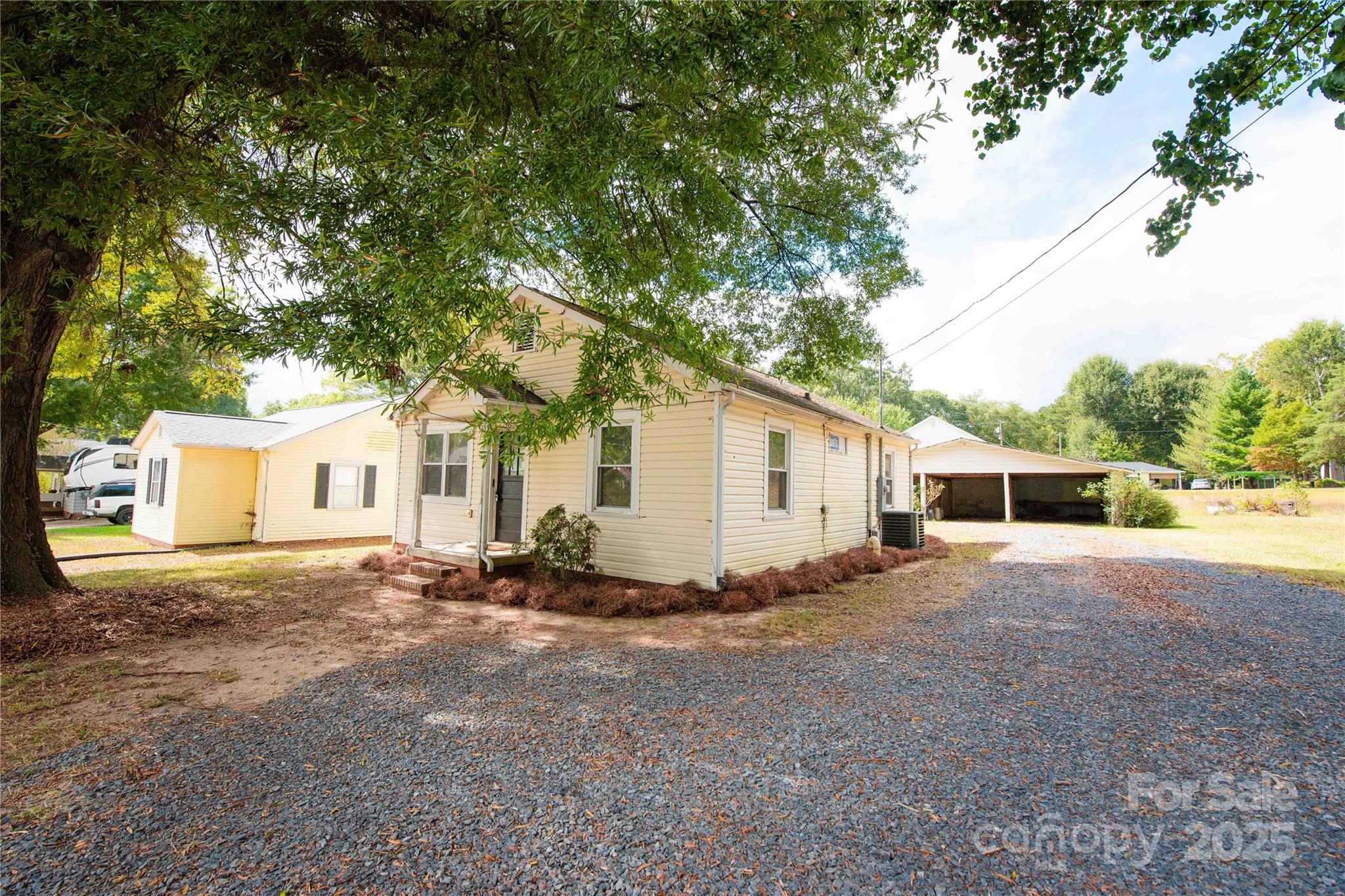 207 North Love Chapel Road Stanfield, NC 28163 - Photo 4 of 21 a view of a house with a yard and large tree
