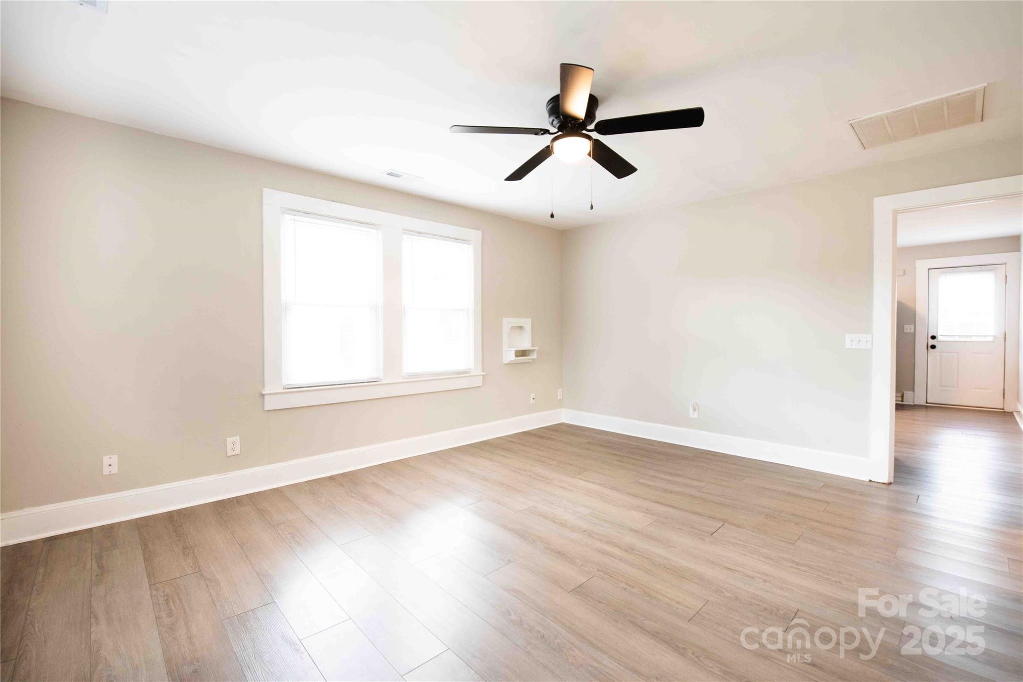 207 North Love Chapel Road Stanfield, NC 28163 - Photo 10 of 21 wooden floor in an empty room with a window