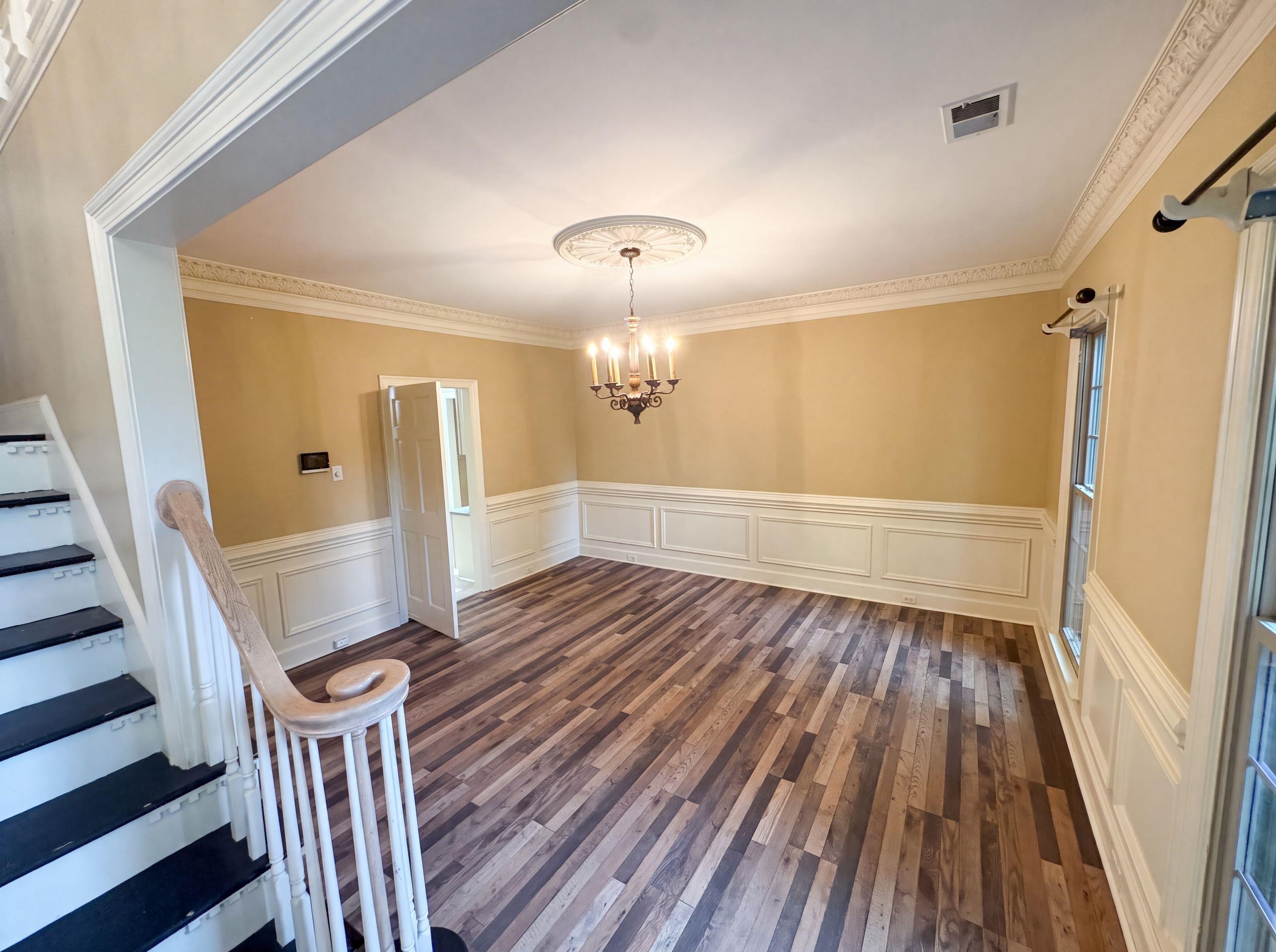 9424 Gotten Road Germantown, TN 38139 - Photo 7 of 27 Spacious room featuring wood-finish flooring and crown molding