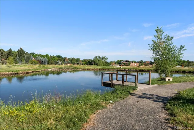 a view of a lake with houses in the back