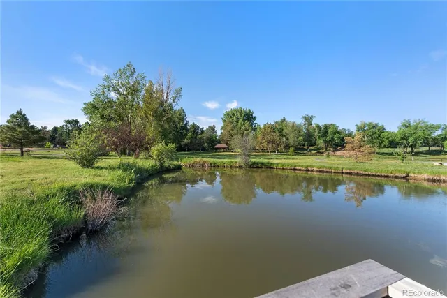 a view of a lake with a yard