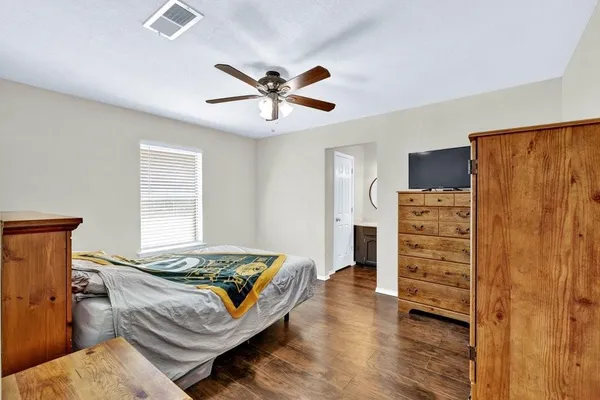 a bedroom with a bed and furniture