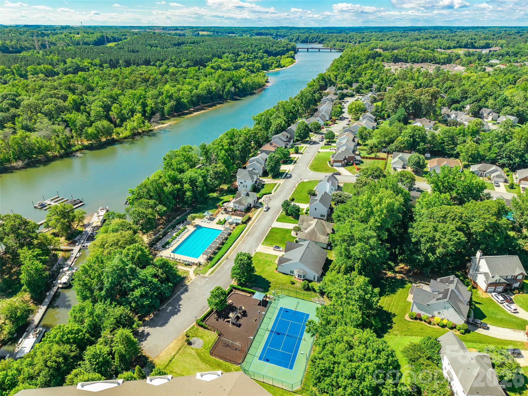 104 Rock Ridge Lane Mount Holly, NC 28120 - Photo 44 of 48 an aerial view of a house with a yard and lake view