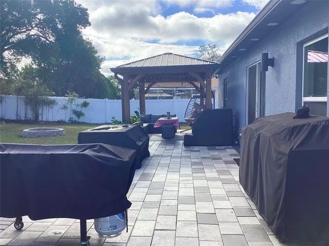 a view of a backyard of the house