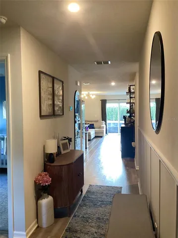 a kitchen with a sink refrigerator and microwave