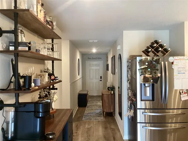 a stove top oven sitting inside of a kitchen