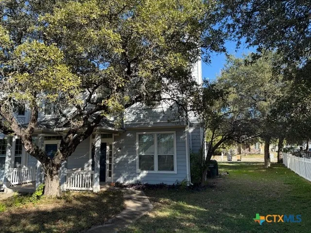 a view of house with yard