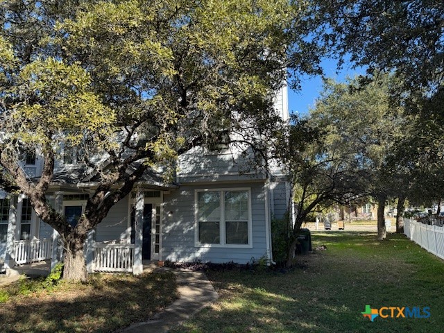 a view of house with yard