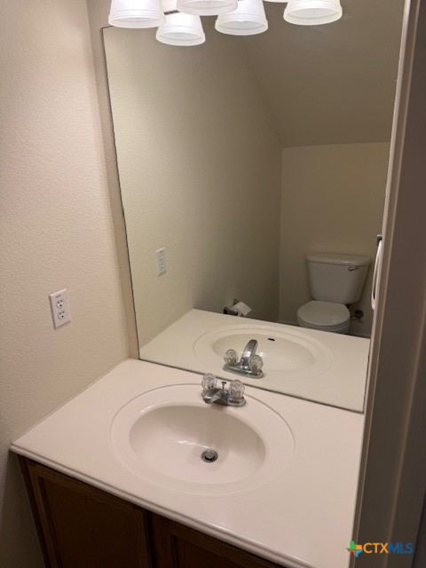 200 Utterback, Unit A Kyle, TX 78640 - Photo 10 of 19 a bathroom with a sink and a mirror