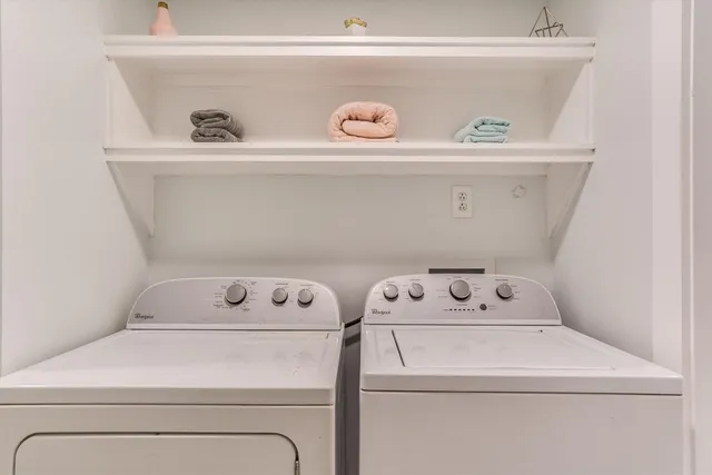 a utility room with washer and dryer