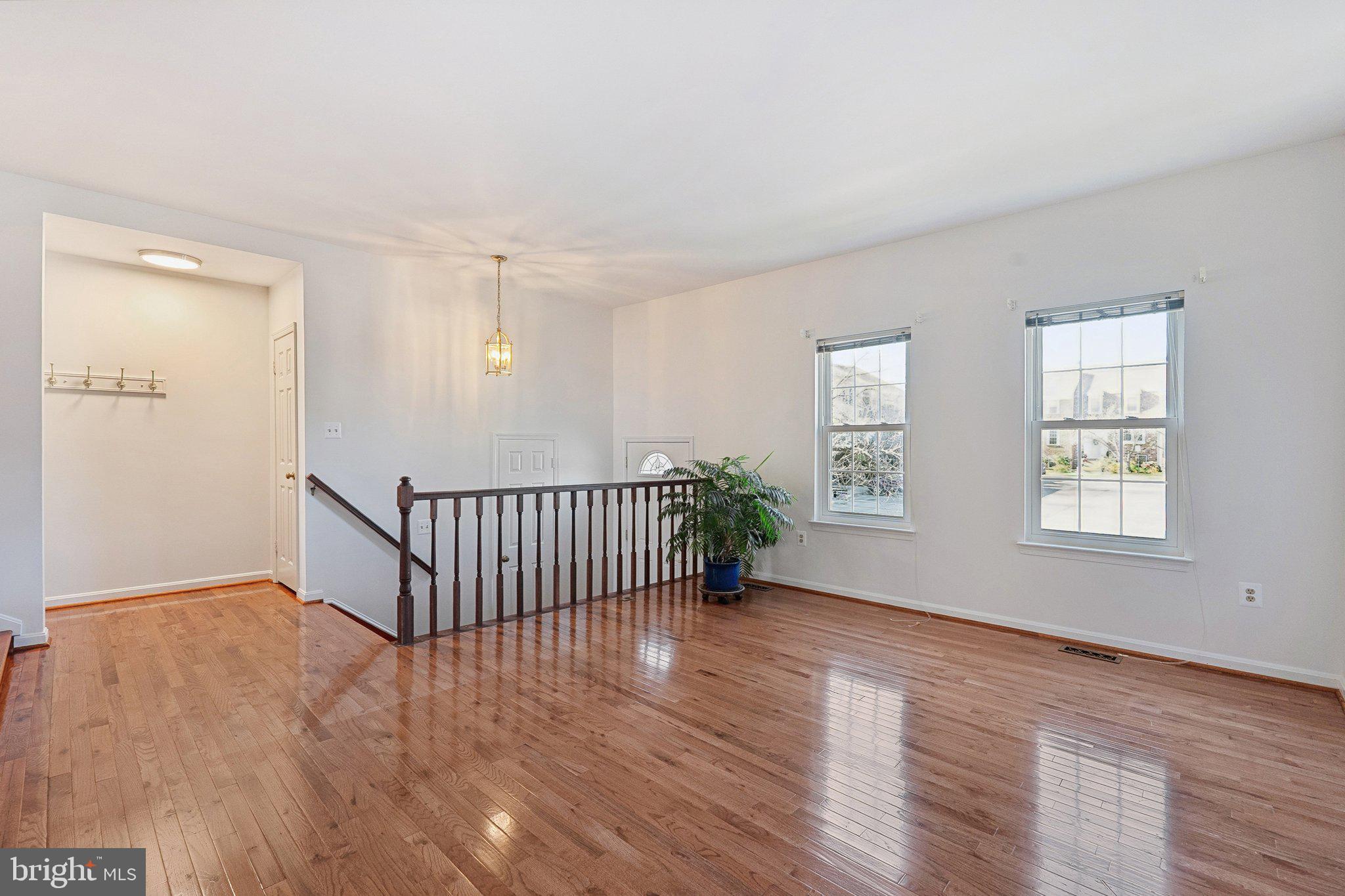 3120 Valentino Court Oakton, VA 22124 - Photo 2 of 25 an empty room with wooden floor and windows