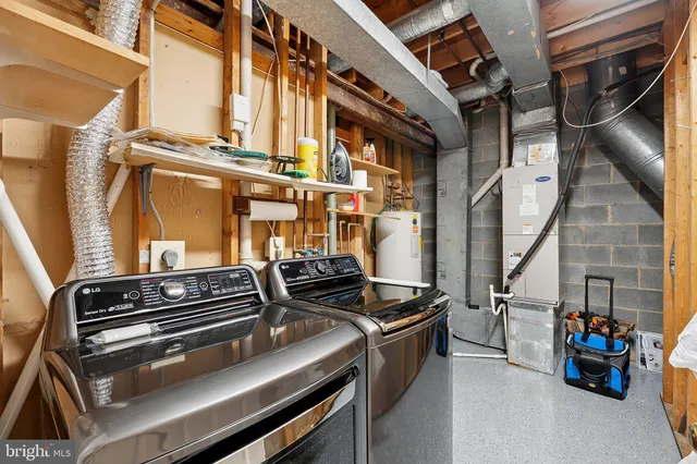a view of an chairs and table in a room
