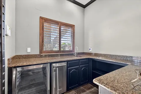 a bathroom with a toilet sink vanity and mirror