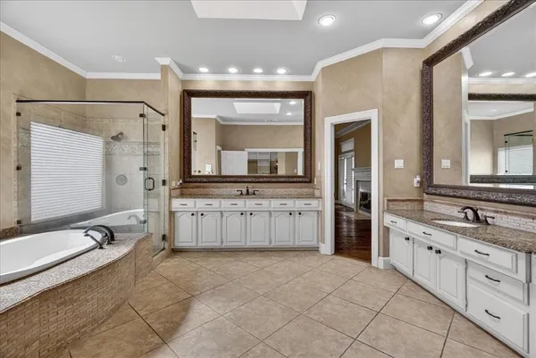 a large bathroom with a granite countertop sink mirror and a