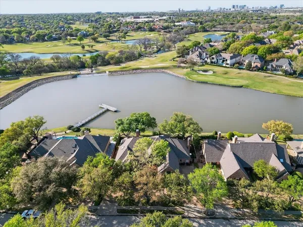 an aerial view of a house with a lake view