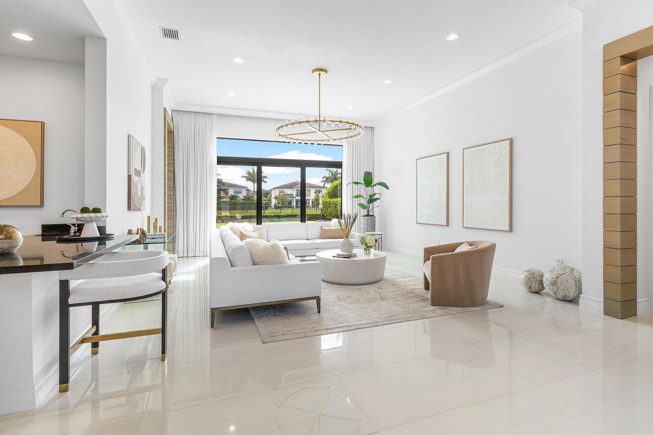 9276 Biaggio Road Boca Raton, FL 33496 - Photo 15 of 70 a living room with furniture and a large window