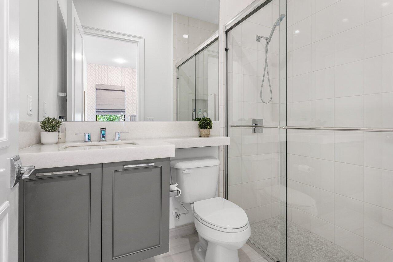 9276 Biaggio Road Boca Raton, FL 33496 - Photo 28 of 70 a bathroom with a sink toilet and shower