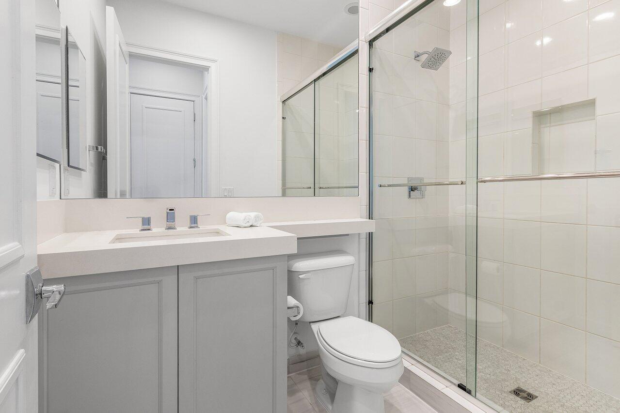 9276 Biaggio Road Boca Raton, FL 33496 - Photo 31 of 70 a bathroom with a sink toilet and shower