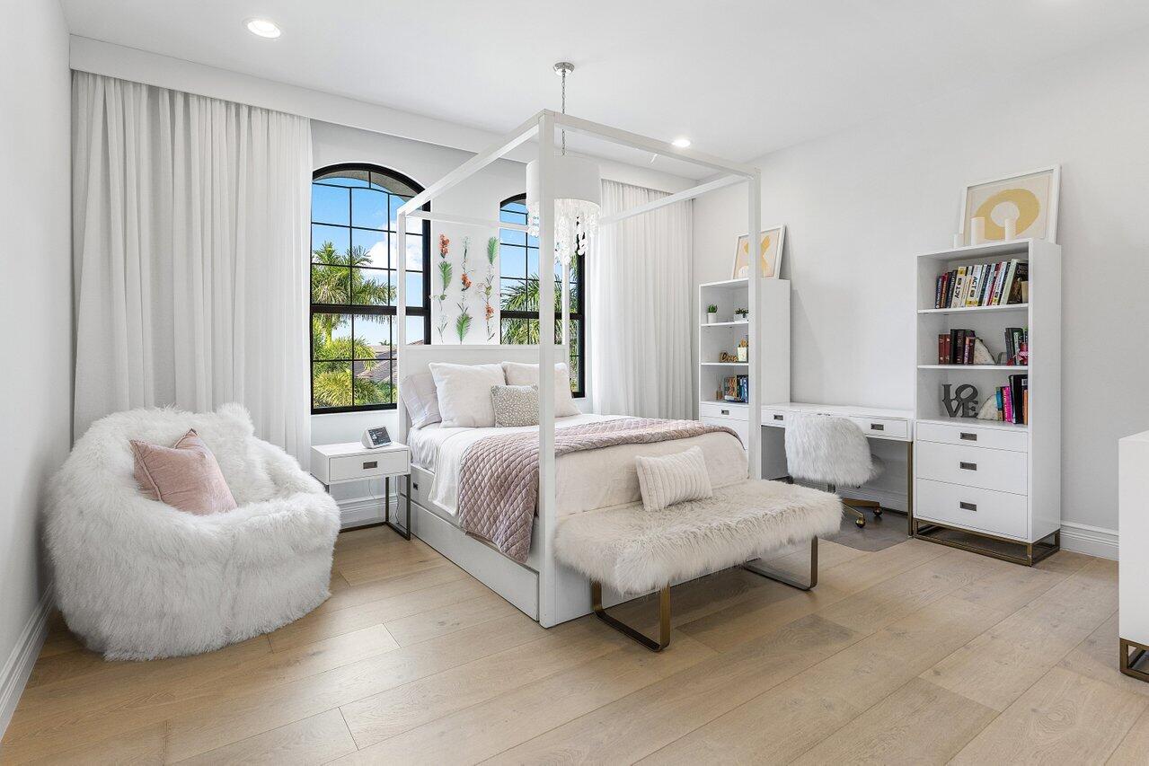 9276 Biaggio Road Boca Raton, FL 33496 - Photo 39 of 70 a spacious bedroom with a bed and a couch