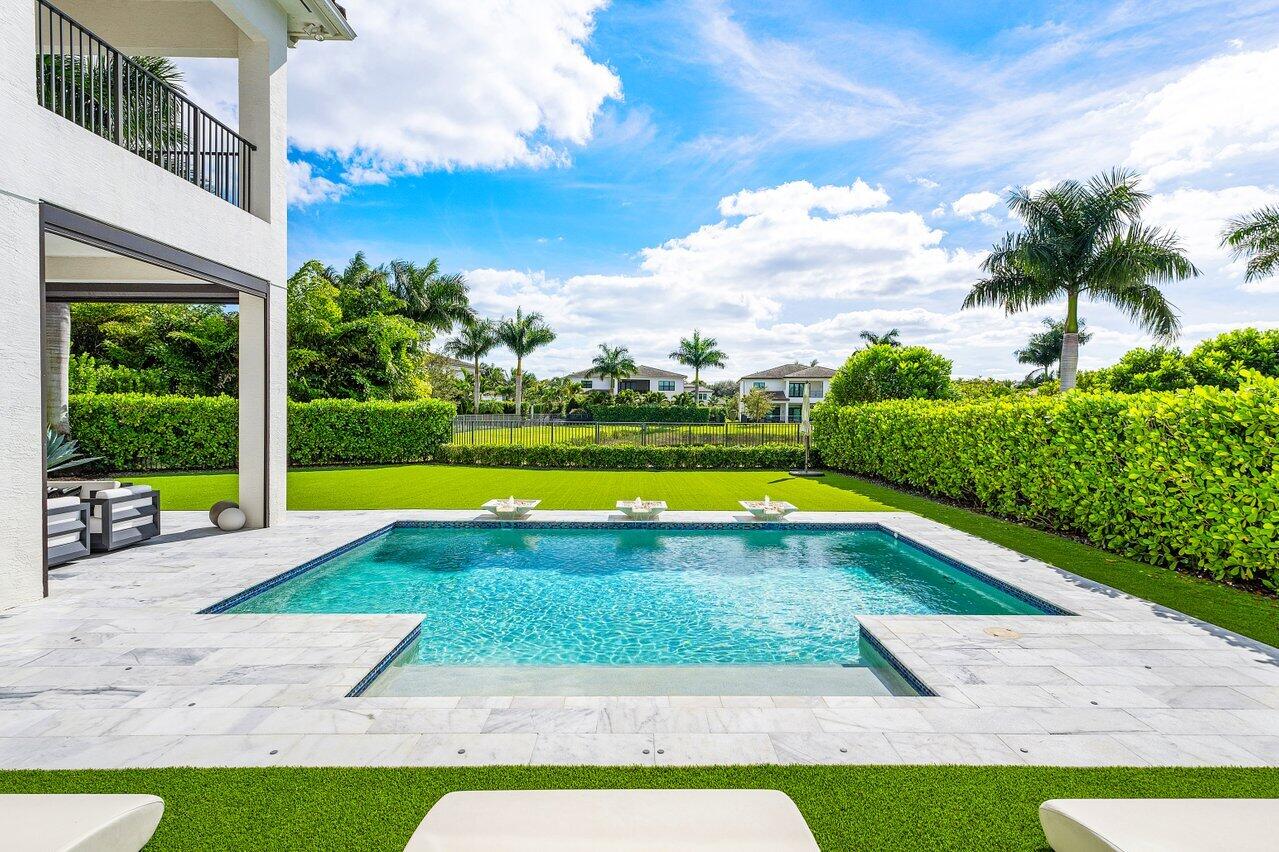 9276 Biaggio Road Boca Raton, FL 33496 - Photo 5 of 70 a view of yard with swimming pool and green space