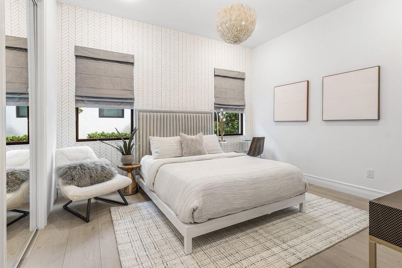 9276 Biaggio Road Boca Raton, FL 33496 - Photo 51 of 70 a bedroom with a bed and a mirror