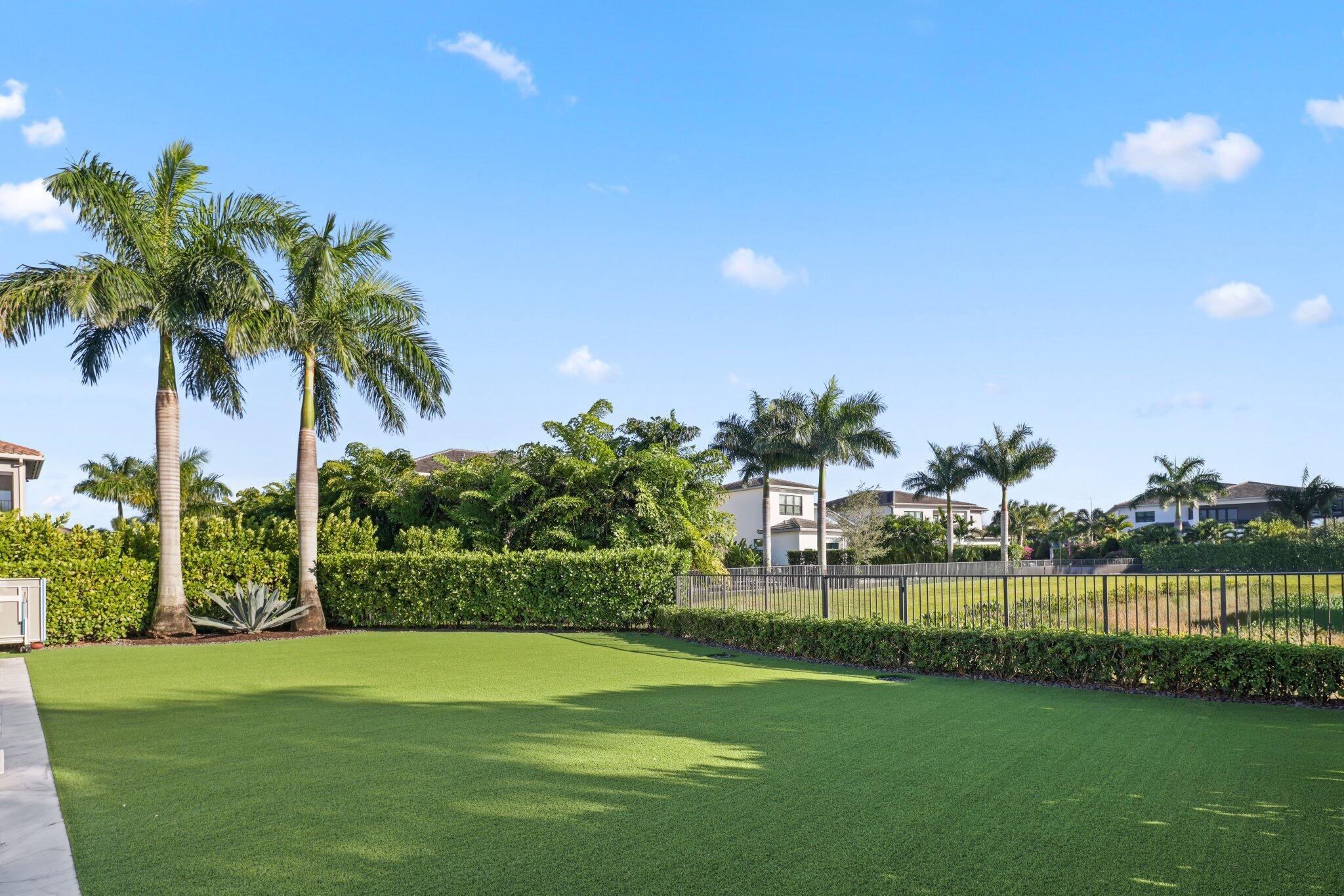9276 Biaggio Road Boca Raton, FL 33496 - Photo 54 of 70 a view of a golf course with a lake view