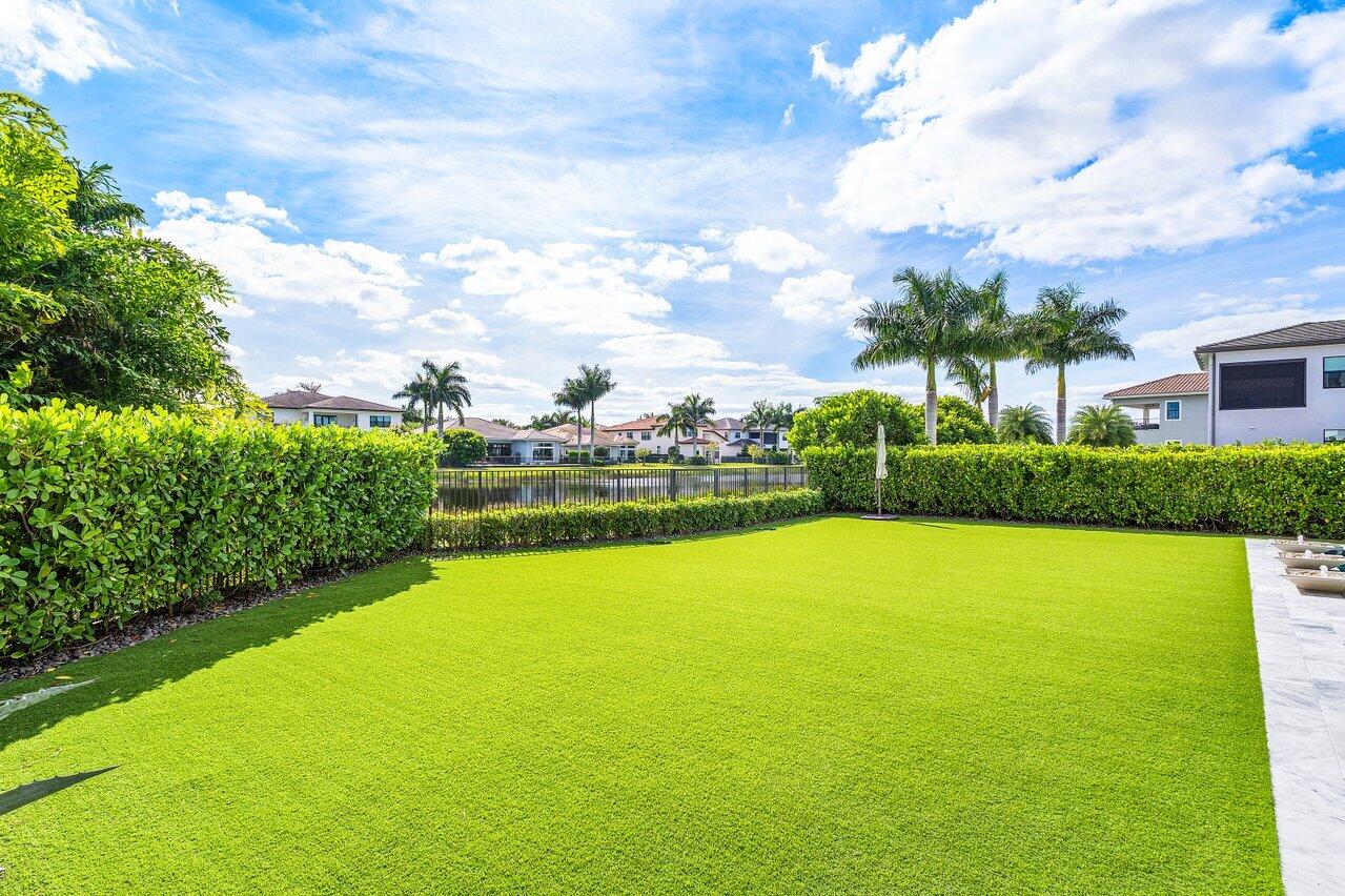 9276 Biaggio Road Boca Raton, FL 33496 - Photo 55 of 70 a view of a garden and basketball court