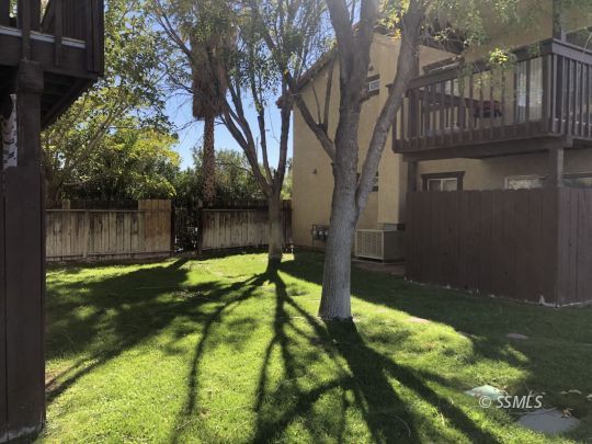 1331 North El Prado Drive Ridgecrest, CA 93555 - Photo 12 of 13 a backyard of a house with lots of green space