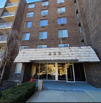 a view of a brick house with many windows