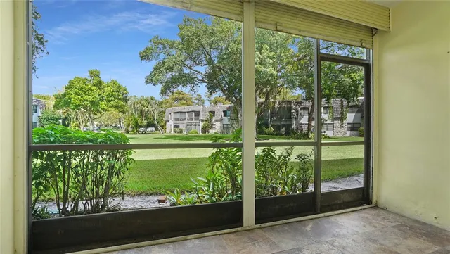 a view of a car park in front of a house