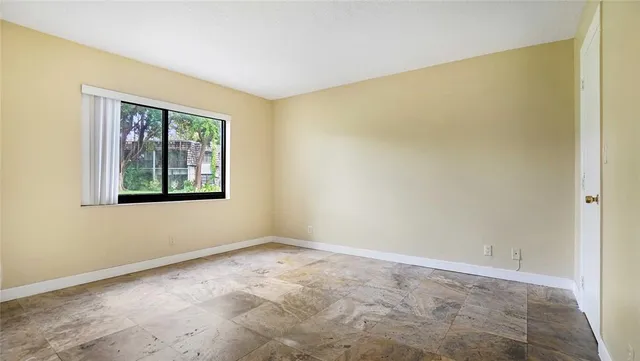 a view of an empty room with a window