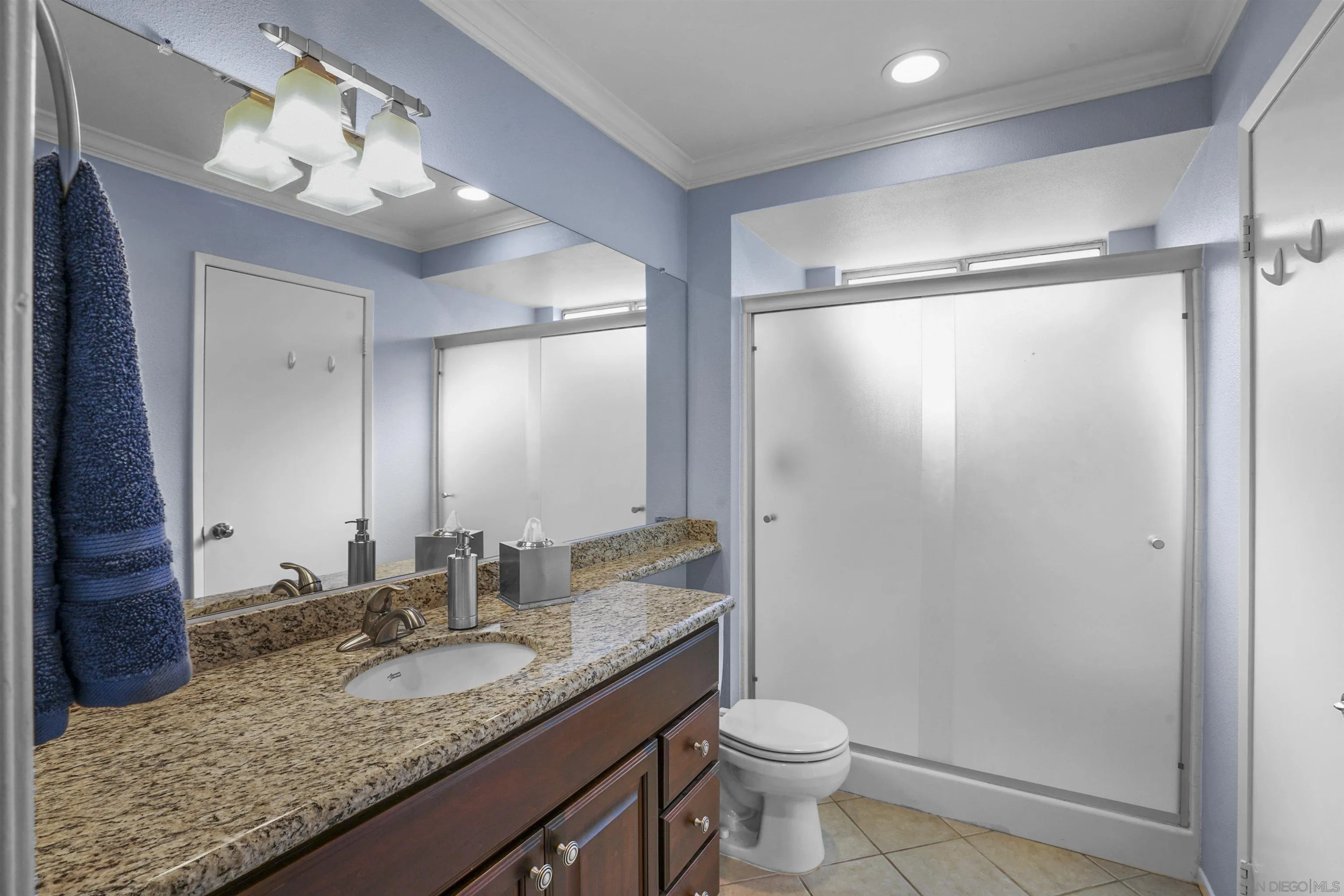 2119 Packard Place El Cajon, CA 92019 - Photo 15 of 29 a bathroom with a granite countertop sink toilet and shower